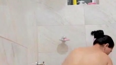 Busty curly brunette with big boobs fucks on couch
