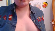 Busty curly brunette with big boobs fucks on couch