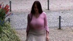 Busty girl walking, no bra, jiggling